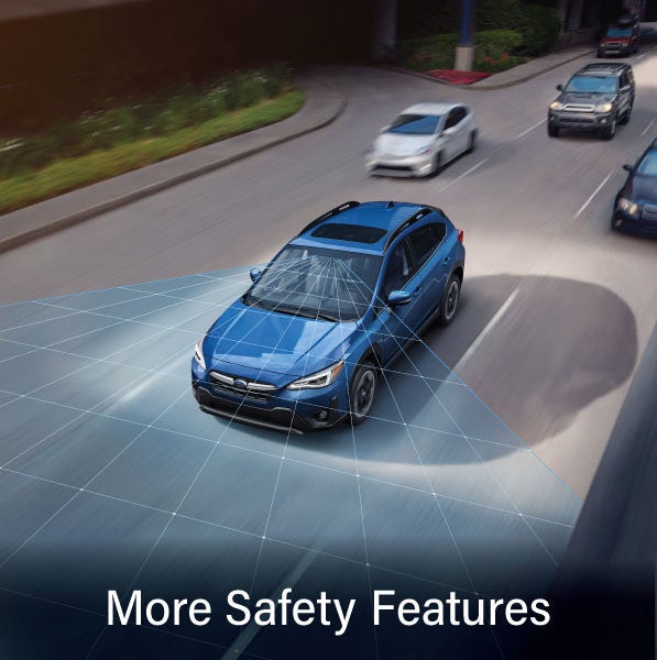 A Subaru Crosstrek in blue with the words “More Safety Features“. | Sutherlin Subaru in Kingston TN